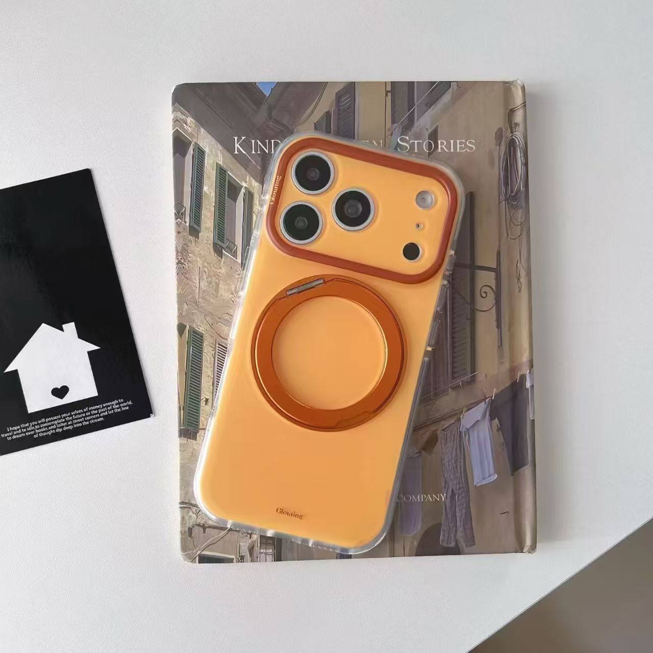 Sunset orange iPhone 17 case with rotating ring stand